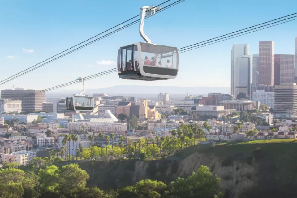 Rendering of aerial gondola passing over Dodger Stadium with L.A. skyline in background